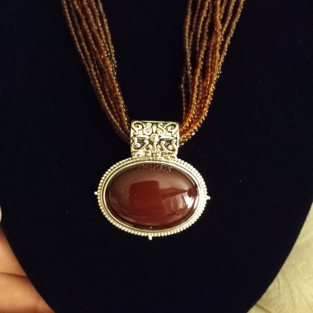 8 strand amber seed bead necklace with pendant